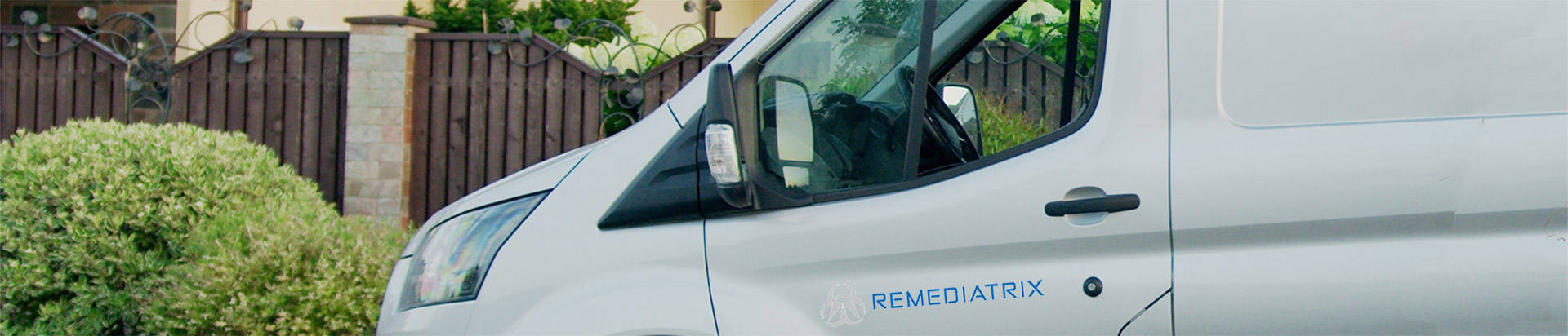 White van with Remediatrix logo on the driver's side door